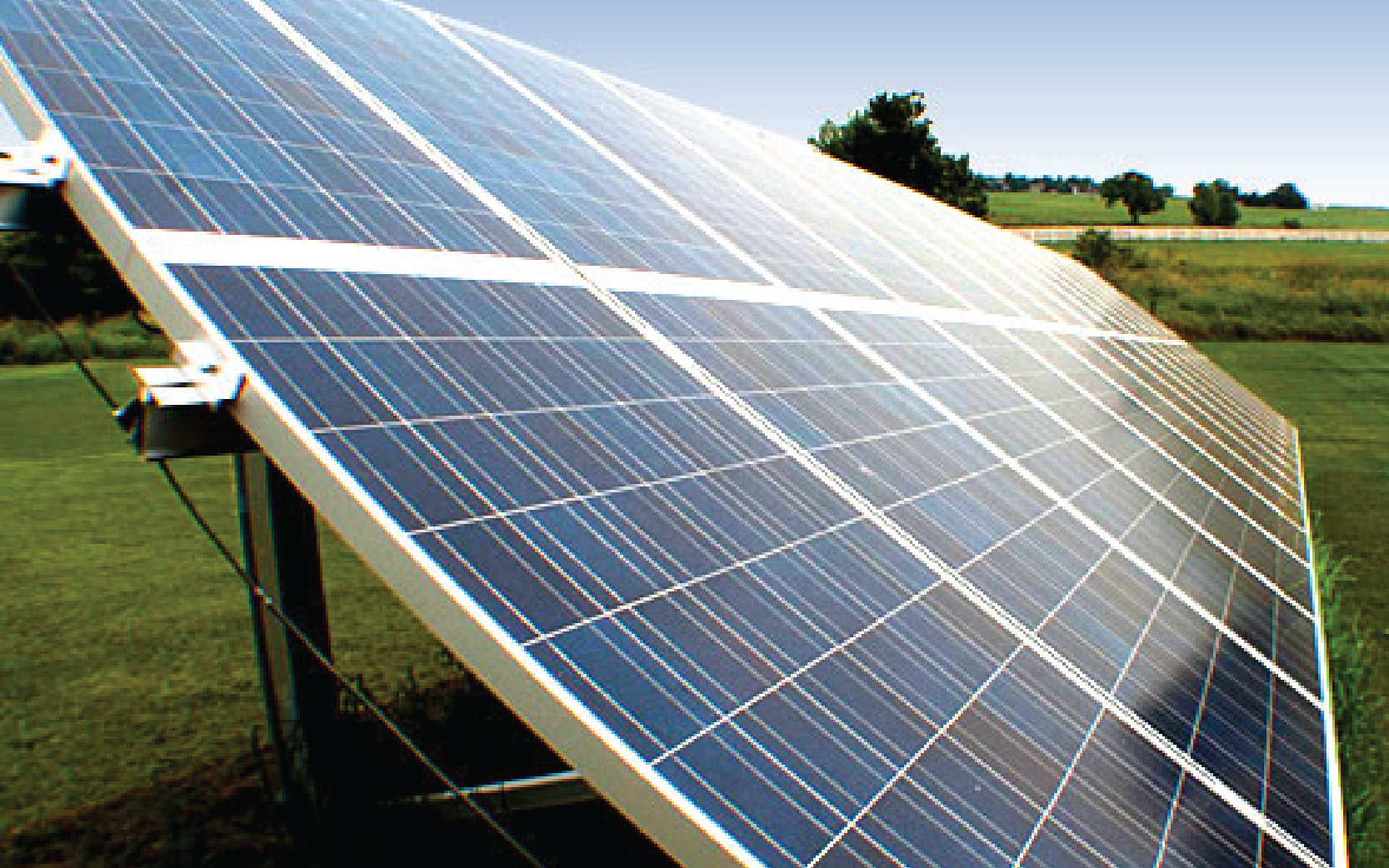 side view of sun hitting solar panels